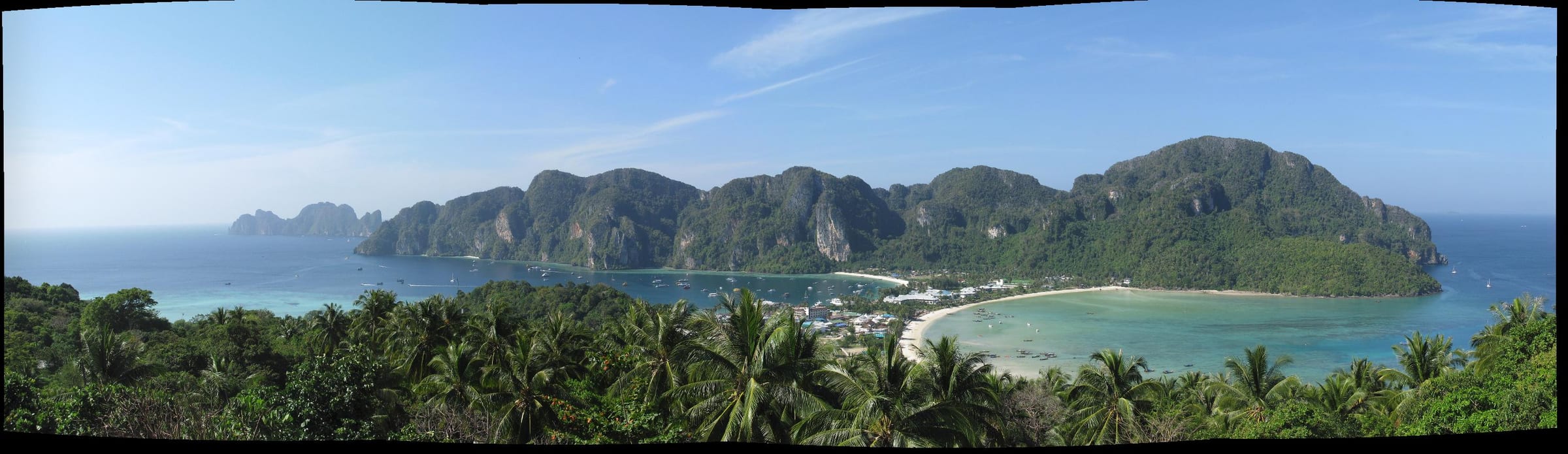Twin turquoise bays and forested karst hills on Ko Phi Phi Don