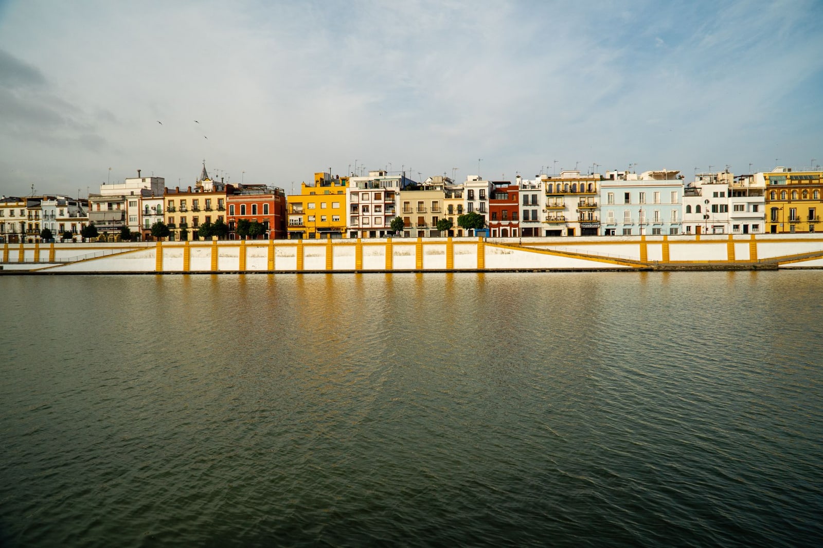 Colourful waterfront buildings in Triana, Seville