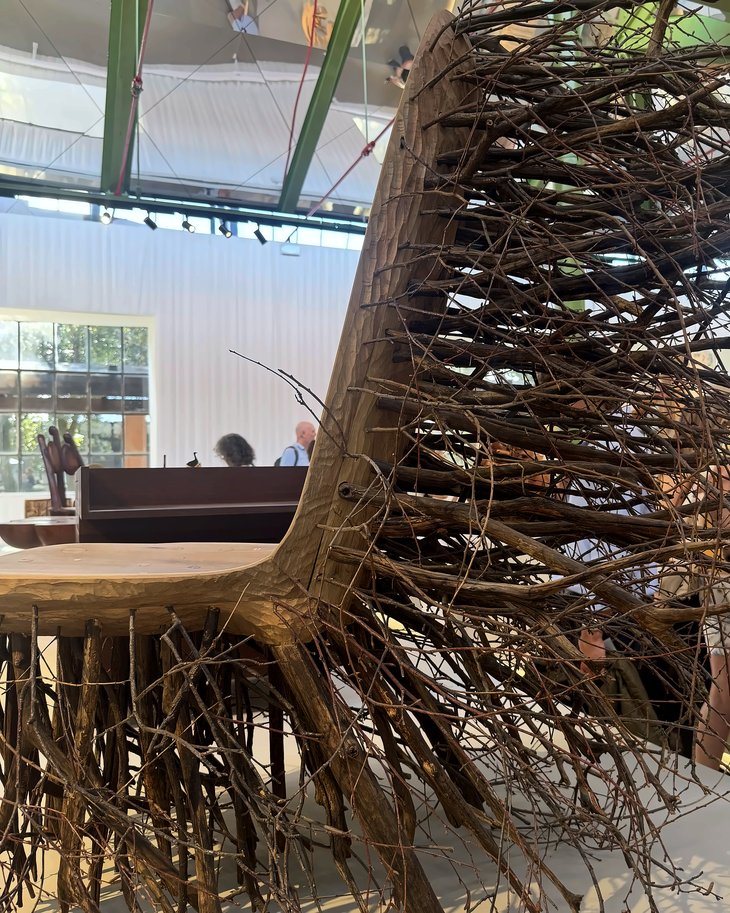 A chair made from a tangle of dark roots and branches